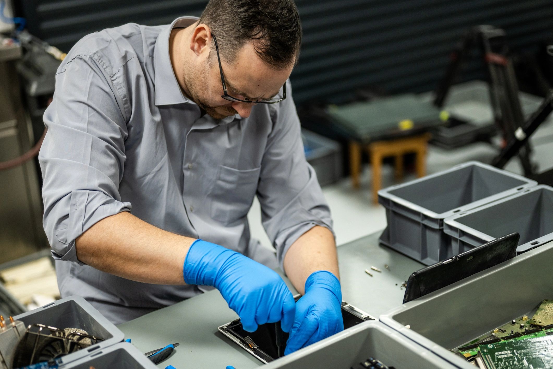 Technician repairing a device representing verification and documentation