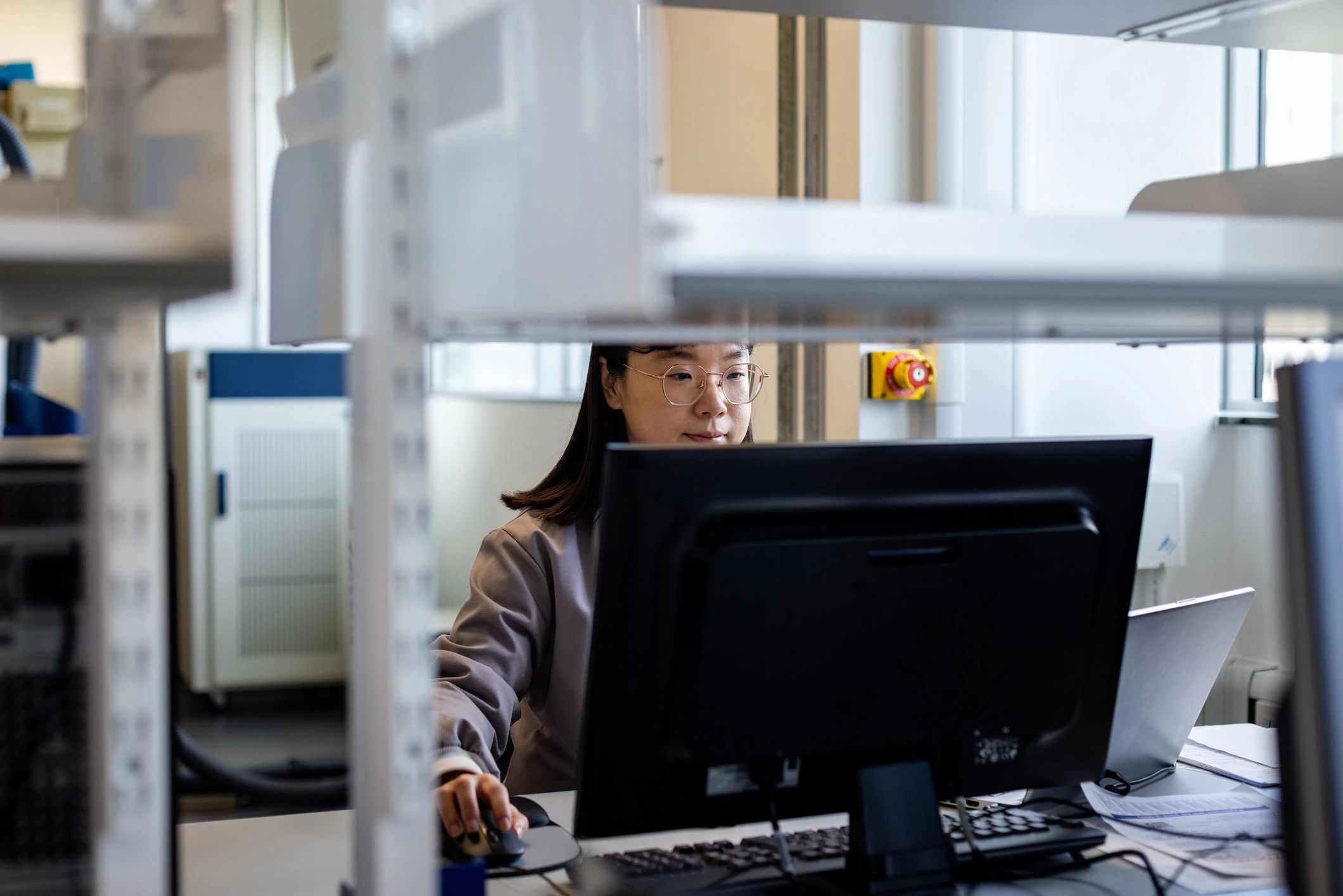 Engineer working at a computer in a lab representing engineering support